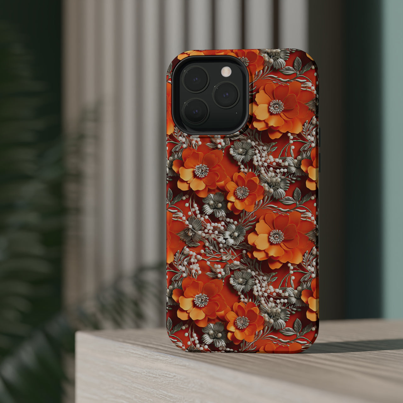 Orange Petals in Silver Tapestry MagSafe Tough Cases for iPhone 13, iPhone 13 Mini, iPhone 13 Pro, and iPhone 13 Pro Max.