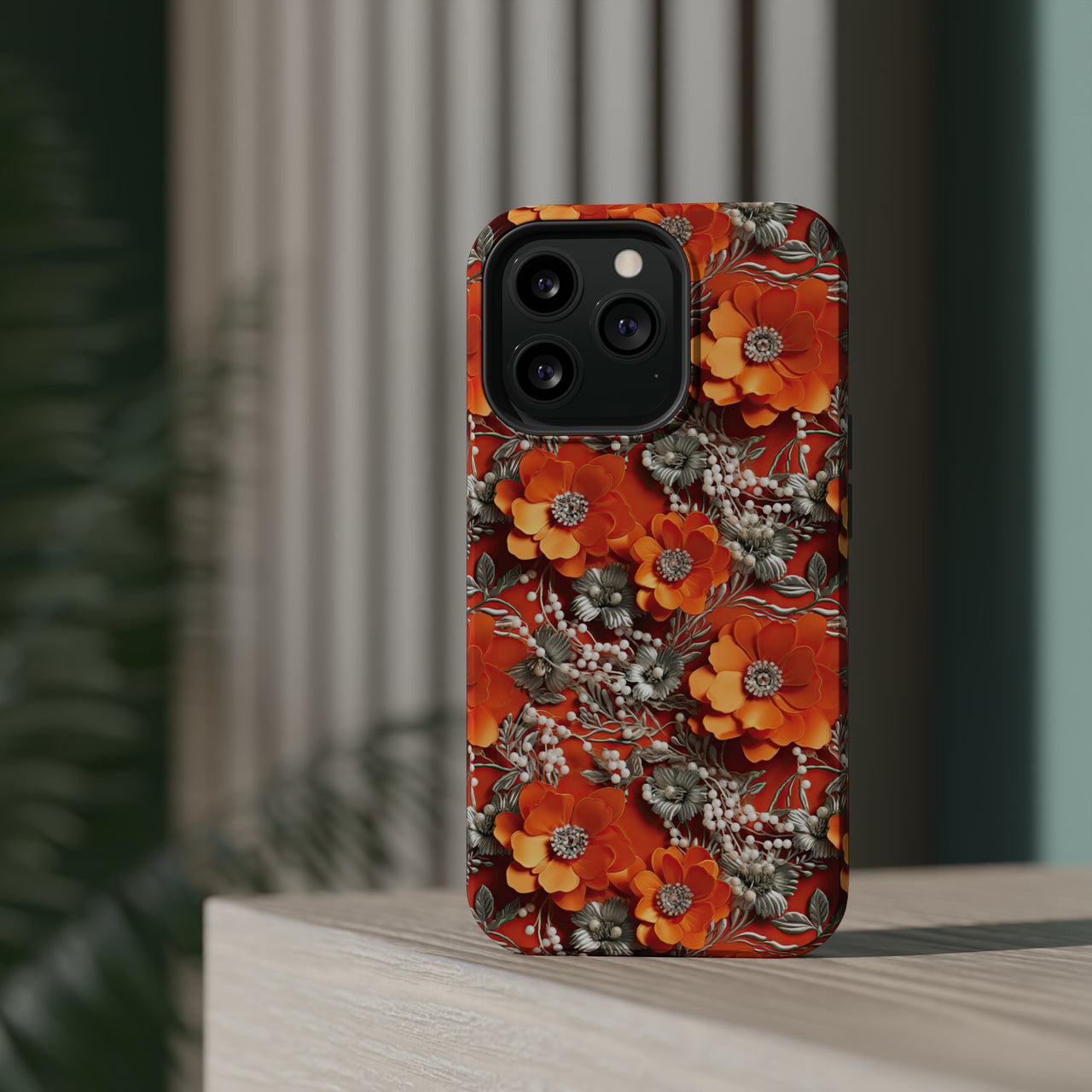 Orange Petals in Silver Tapestry MagSafe Tough Cases for iPhone 13, iPhone 13 Mini, iPhone 13 Pro, and iPhone 13 Pro Max.