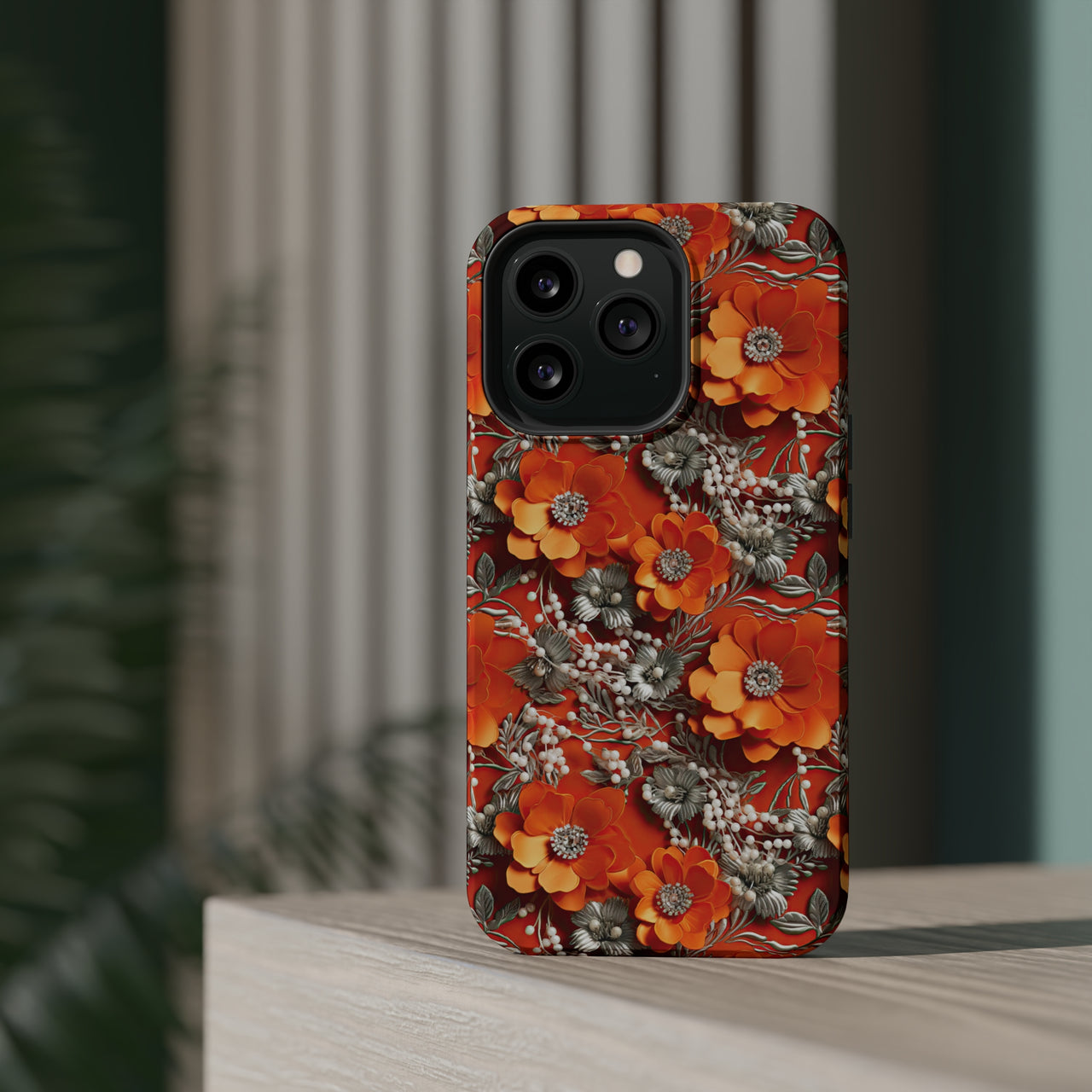 Orange Petals in Silver Tapestry MagSafe Tough Cases for iPhone 13, iPhone 13 Mini, iPhone 13 Pro, and iPhone 13 Pro Max.